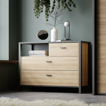Load image into Gallery viewer, High Rock Chest of Drawers in Matt Black/Riviera Oak Furniture To Go 801hrkk211-m197 5904767839642 High Rock, a captivating and contemporary collection which has a perfect blend of the Riviera Oak decor with deep black accents, this collection immediately captivates attention with its originality. The sleek black metal handles add a touch of elegance, while the tables boast robust metal legs in a frame-like design, contributing to a distinct loft character within the space. Beyond its striking aesthetics, H
