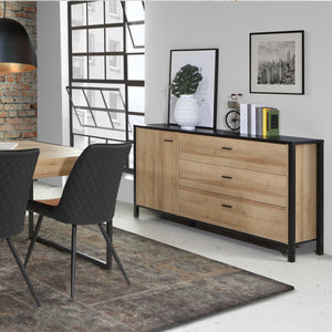 High Rock Sideboard in Matt Black/Riviera Oak Furniture To Go 801hrkk221-m197 5904767825478 High Rock, a captivating and contemporary collection which has a perfect blend of the Riviera Oak decor with deep black accents, this collection immediately captivates attention with its originality. The sleek black metal handles add a touch of elegance, while the tables boast robust metal legs in a frame-like design, contributing to a distinct loft character within the space. Beyond its striking aesthetics, High Roc