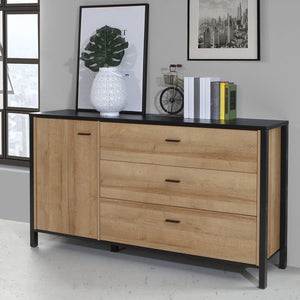 High Rock Sideboard in Matt Black/Riviera Oak Furniture To Go 801hrkk221-m197 5904767825478 High Rock, a captivating and contemporary collection which has a perfect blend of the Riviera Oak decor with deep black accents, this collection immediately captivates attention with its originality. The sleek black metal handles add a touch of elegance, while the tables boast robust metal legs in a frame-like design, contributing to a distinct loft character within the space. Beyond its striking aesthetics, High Roc