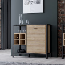 Load image into Gallery viewer, High Rock Storage / Display Chest in Matt Black/Riviera Oak Furniture To Go 801hrkk223-m197 5904767832834 High Rock, a captivating and contemporary collection which has a perfect blend of the Riviera Oak decor with deep black accents, this collection immediately captivates attention with its originality. The sleek black metal handles add a touch of elegance, while the tables boast robust metal legs in a frame-like design, contributing to a distinct loft character within the space. Beyond its striking aesthe