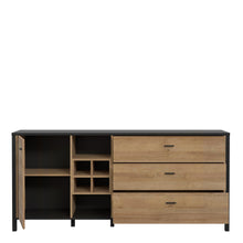 Load image into Gallery viewer, High Rock (Large) Sideboard in Matt Black/Riviera Oak Furniture To Go 801hrkk231-m197 5904767825485 High Rock, a captivating and contemporary collection which has a perfect blend of the Riviera Oak decor with deep black accents, this collection immediately captivates attention with its originality. The sleek black metal handles add a touch of elegance, while the tables boast robust metal legs in a frame-like design, contributing to a distinct loft character within the space. Beyond its striking aesthetics, 