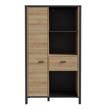 Load image into Gallery viewer, High Rock Wide Shelf Unit in Matt Black/Riviera Oak Furniture To Go 801hrkr521l-m197 5904767840686 High Rock, a captivating and contemporary collection which has a perfect blend of the Riviera Oak decor with deep black accents, this collection immediately captivates attention with its originality. The sleek black metal handles add a touch of elegance, while the tables boast robust metal legs in a frame-like design, contributing to a distinct loft character within the space. Beyond its striking aesthetics, H