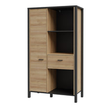 Load image into Gallery viewer, High Rock Wide Shelf Unit in Matt Black/Riviera Oak Furniture To Go 801hrkr521l-m197 5904767840686 High Rock, a captivating and contemporary collection which has a perfect blend of the Riviera Oak decor with deep black accents, this collection immediately captivates attention with its originality. The sleek black metal handles add a touch of elegance, while the tables boast robust metal legs in a frame-like design, contributing to a distinct loft character within the space. Beyond its striking aesthetics, H