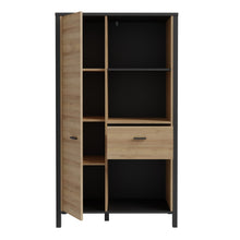 Load image into Gallery viewer, High Rock Wide Shelf Unit in Matt Black/Riviera Oak Furniture To Go 801hrkr521l-m197 5904767840686 High Rock, a captivating and contemporary collection which has a perfect blend of the Riviera Oak decor with deep black accents, this collection immediately captivates attention with its originality. The sleek black metal handles add a touch of elegance, while the tables boast robust metal legs in a frame-like design, contributing to a distinct loft character within the space. Beyond its striking aesthetics, H