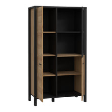 Load image into Gallery viewer, High Rock Small Display Cabinet in Matt Black/Riviera Oak Furniture To Go 801hrkv521-m197 5904767827199 High Rock, a captivating and contemporary collection which has a perfect blend of the Riviera Oak decor with deep black accents, this collection immediately captivates attention with its originality. The sleek black metal handles add a touch of elegance, while the tables boast robust metal legs in a frame-like design, contributing to a distinct loft character within the space. Beyond its striking aestheti