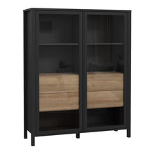 Load image into Gallery viewer, High Rock Extra Wide Display Cabinet in Matt Black/Riviera Oak Furniture To Go 801hrkv522-m197 5904767825508 High Rock, a captivating and contemporary collection which has a perfect blend of the Riviera Oak decor with deep black accents, this collection immediately captivates attention with its originality. The sleek black metal handles add a touch of elegance, while the tables boast robust metal legs in a frame-like design, contributing to a distinct loft character within the space. Beyond its striking aes