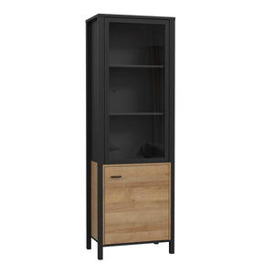 High Rock Wide Display Cabinet in Matt Black/Riviera Oak Furniture To Go 801hrkv711-m197 5904767825515 High Rock, a captivating and contemporary collection which has a perfect blend of the Riviera Oak decor with deep black accents, this collection immediately captivates attention with its originality. The sleek black metal handles add a touch of elegance, while the tables boast robust metal legs in a frame-like design, contributing to a distinct loft character within the space. Beyond its striking aesthetic