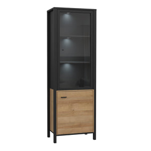 High Rock Wide Display Cabinet in Matt Black/Riviera Oak Furniture To Go 801hrkv711-m197 5904767825515 High Rock, a captivating and contemporary collection which has a perfect blend of the Riviera Oak decor with deep black accents, this collection immediately captivates attention with its originality. The sleek black metal handles add a touch of elegance, while the tables boast robust metal legs in a frame-like design, contributing to a distinct loft character within the space. Beyond its striking aesthetic