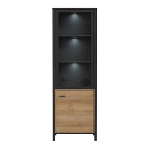 High Rock Wide Display Cabinet in Matt Black/Riviera Oak Furniture To Go 801hrkv711-m197 5904767825515 High Rock, a captivating and contemporary collection which has a perfect blend of the Riviera Oak decor with deep black accents, this collection immediately captivates attention with its originality. The sleek black metal handles add a touch of elegance, while the tables boast robust metal legs in a frame-like design, contributing to a distinct loft character within the space. Beyond its striking aesthetic