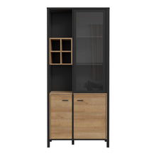 Load image into Gallery viewer, High Rock Display Cabinet in Matt Black/Riviera Oak Furniture To Go 801hrkv721r-m197 5904767825522 High Rock, a captivating and contemporary collection which has a perfect blend of the Riviera Oak decor with deep black accents, this collection immediately captivates attention with its originality. The sleek black metal handles add a touch of elegance, while the tables boast robust metal legs in a frame-like design, contributing to a distinct loft character within the space. Beyond its striking aesthetics, H