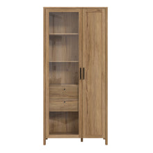 Load image into Gallery viewer, Malte Brun Display Cabinet in Waterford Oak Furniture To Go 801mtbv721r-d84 5904767829568 Step into a world of refined beauty and exquisite charm with the noble Waterford Oak decor, an exceptional masterpiece that flawlessly imitates the allure of natural wood. Designed to infuse your interior with warmth and sophistication, this extraordinary creation is set to elevate your living space to new heights of opulence. Dimensions: 2067mm x 965mm x 415mm (Height x Width x Depth) 
 Modern Country Style 
 Rich, wa