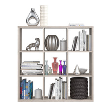 Load image into Gallery viewer, Mauro 3x3 Storage Unit in Sand Oak Furniture To Go 801mxxr331-d41f 5904767513092 Mauro units – the epitome of stylish, simple cube storage shelving with endless possibilities. These units will effortlessly transform your living area into a haven of organisation and sophistication. With a range of sizes and colours to choose from, customising your Mauro storage unit to suit your unique style is a breeze. Dimensions: 1073mm x 1072mm x 329mm (Height x Width x Depth) 
 Modern cube style storage unit 
 9 open st