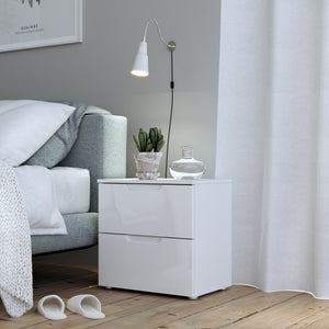 Sienna Bedside in White/White High Gloss Furniture To Go 801snnk011-v29 5904767867515 The Sienna collection, a mesmerising fusion of white high gloss living and bedroom furniture that embodies the essence of modern sophistication. With its contemporary allure, the Sienna collection effortlessly complements any room decor, making it a versatile and stylish choice for your home. Dimensions: 497mm x 504mm x 344mm (Height x Width x Depth) 
 Modern, sleek design 
 White gloss finish 
 2 drawers 
 Cut-out handles