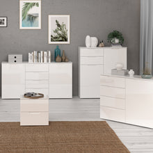 Load image into Gallery viewer, Sienna Chest of Drawers in White/White High Gloss Furniture To Go 801snnk421-v29 5904767147846 The Sienna collection, a mesmerising fusion of white high gloss living and bedroom furniture that embodies the essence of modern sophistication. With its contemporary allure, the Sienna collection effortlessly complements any room decor, making it a versatile and stylish choice for your home. Dimensions: 1201mm x 1101mm x 344mm (Height x Width x Depth) 
 Modern, sleek design 
 White gloss finish 
 2 doors 
 2 draw