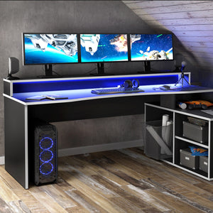 Tezaur Gaming Desk with LED in Black/White in White/Black Furniture To Go 801tzrb214b3-m240 5904767837754 Bold, stylish, and designed to cater to every gaming enthusiast's dream, the Tezaur is more than just a desk; it's an experience. Crafted with precision and attention to detail, this masterpiece is the perfect companion for your customers gaming consoles, elevating their setup to new heights. And let's talk about lighting - the Tezaur takes it to the next level. Embedded with built-in strip lights, this