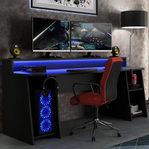 Tezaur Gaming Desk with Blue LED in Matt Black Furniture To Go 801tzrb215b3-z113 5904767896584 Bold, stylish, and designed to cater to every gaming enthusiast's dream, the Tezaur is more than just a desk; it's an experience. Crafted with precision and attention to detail, this masterpiece is the perfect companion for your customers gaming consoles, elevating their setup to new heights. And let's talk about lighting - the Tezaur takes it to the next level. Embedded with built-in strip lights, this desk will 