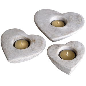 Set Of Three Heart Tea Light Holders in CREAM Hill Interiors 9066 5050140906606 Dimensions: 35cm x 16cm x 5cm Weight: 1.5kg Volume: 0.05CBM Set of three of stone effect heart shaped tea light holders with antiqued finish.