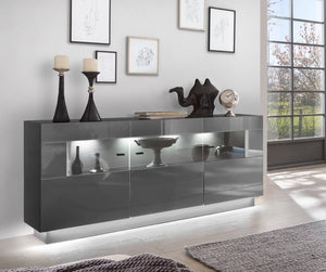 Denira 84 Display Sideboard Cabinet Arte-N A4DEQQ08403 The Denira display sideboard is a stunning choice for bringing high-gloss style to your home. This piece features three partially glassed hinged doors with a total of nine compartments behind, meaning that it is perfect both for keeping ornaments or for storing everyday essentials. The cabinet is finished in the captivating graphite gloss, giving it a touch of class that will enhance any living space. Full W162cm x H86cm x D40cm Colours Front: Graphite 