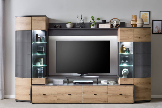 Flori VA Entertainment Media Wall Unit Arte-N A4FLQTVA The Flora VA entertainment unit is a statement piece for any living room. It features an elegant, minimalist design with a timeless oak finish natural wood grains. A combination of open closed compartments, shelves drawers are available for housing all your entertainment accessories. W300cm x H194cm x D54cm Colour: Oak Artisan Graphite Four Hinged Doors Four Drawers Sixteen Interior Shelves Shelf Three Open Storage Compartments Made from 16mm high-quali