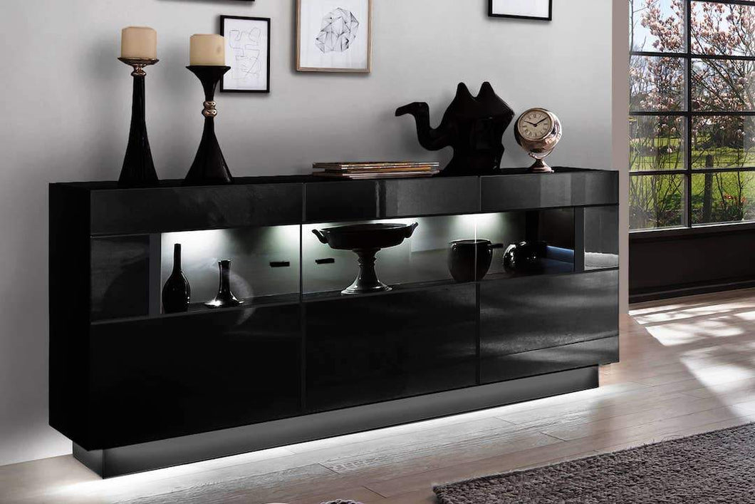 Nata 84 Display Sideboard Cabinet Arte-N A4NASS084 Sleek ultra-modern, this sideboard cabinet with three partially-glassed hinged doors is a gorgeous addition to any room. Its interior can be upgraded with optional LED lights to put a spotlight on exhibited items. Full W160cm x H85cm x D43cm Colours Front: Black High Gloss Carcass: Black Matt Three Partially glassed Doors LED Lighting - Optional Made from 16mm high-quality laminated board Matching Wall Unit Available Assembly Required Weight: 68kg Estimated
