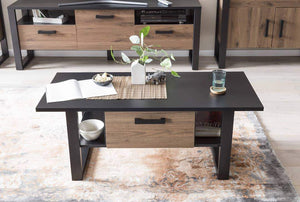 Nordi Coffee Table Arte-N A4NRSK900 Its modern, rectangular design makes this coffee table versatile highly practical. Two open compartments on either side of the drawer provide storage space for magazines, newspapers other daily essentials, while the drawer itself is large enough to store remote controllers, casual snacks similar small items without cramping your visual space. Finished in an elegant combination of matt black warm oak tones, this stylish coffee table will enhance any decor. W110cm x H48cm x