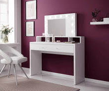 Load image into Gallery viewer, Aria Dressing Table With Mirror Arte-N 2497KF49 This stylish, compact vanity table is ideal for any bedroom. It includes a mirror with LED lighting ample shelving space for cosmetics. One large drawer provides storage space for jewellery valuables. The dressing table is made from high-quality 16mm laminated board comes in a white gloss finish. W120cm x H136cm x D40cm Colour: Front: White Gloss Carcass: White Matt Drawer Mirror LED Lighting Included Made from 16mm high-quality laminated board Assembly Requir