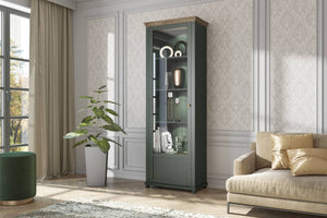 Evora 05 Tall Display Cabinet [Left] Arte-N 24ZRJU05 Discover the beauty of a traditional display cabinet with this stunning piece from Evora. With partially-glazed hinged door five compartments, it has all your needs covered. Its stunning oak finish makes this cabinet both elegant welcoming. Boasting a sturdy 16mm laminated board carcass, this high quality unit takes pride of place in any modern home. W71cm x H200cm x D42cm Colours: Green Oak Lefkas Abisko Ash Oak Lefkas Partially Glassed Door Three Shelve