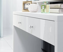 Load image into Gallery viewer, Aria Dressing Table With Mirror Arte-N 2497KF49 This stylish, compact vanity table is ideal for any bedroom. It includes a mirror with LED lighting ample shelving space for cosmetics. One large drawer provides storage space for jewellery valuables. The dressing table is made from high-quality 16mm laminated board comes in a white gloss finish. W120cm x H136cm x D40cm Colour: Front: White Gloss Carcass: White Matt Drawer Mirror LED Lighting Included Made from 16mm high-quality laminated board Assembly Requir