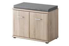 Load image into Gallery viewer, Armario Hallway Bench Arte-N DS AR TYP F + P This multipurpose cabinet + bench combo is ideal for the hallway. The two hinged doors conceal storage for shoes, boot scrapers other general items. A soft upholstered top offers a comfortable place to sit, while its timeless Oak Sonoma decor will look great in any home. W60cm x H46cm x D32cm Colour: Oak Sonoma Two Hinged Doors Shelf [Maximum 7kg Weight Limit] Matching Furniture Available Made from 16mm high-quality laminated board Assembly Required Weight: 16kg 