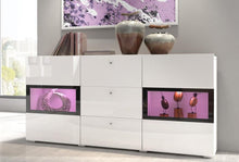 Load image into Gallery viewer, Baros 26 - Sideboard Cabinet Arte-N 24O1BM26 Made from the finest materials with stunning features, this sideboard cabinet from the Baros collection is a glamorously designed furniture for those who value aesthetics. It boasts two partially-glazed hinged doors a trio of drawers, providing display space for prized possessions concealed space for essentials mundane items. Thanks to its elegant design, this sideboard will effortlessly enrich your interior. W132cm x H70cm x D39cm Colour: Concrete Grey Oak San R