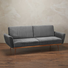 Load image into Gallery viewer, Nico Grey Sofa Bed LPD NICOGREY* 5036464072203 Colour: Grey Dimensions: 850mm x 2100mm x 830mm Luxury at its finest, the Nico sofa is practical yet stylish. With eye-catching, beautiful cooper effect base and legs, the lavish velvet reflects against this to provide a plush comfy seating area. This is a great asset to have in your home as it is easy and ready to transfer into space for your guests to sleep!