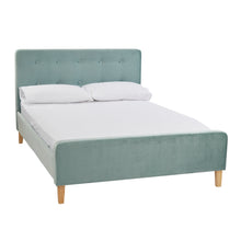 Load image into Gallery viewer, Pierre 4.6 Double Bed Aqua LPD PIERRE4.6* 5036464058665 Crushed Velvet Colour: Aqua Dimensions: 1040mm x 1445mm x 2085mm The Pierre Double Bed is a simple yet stylish soft, velvet aqua upholstered bed with contrasting light wooden legs and a classic button detail to the headboard. Elegantly clad in the same aqua upholstery as the headboard, the frame and footboard is inviting and sumptuous. Characterising a relaxing and calm environment, this bed is delicious in its design and will make any bedroom into a s