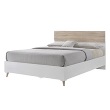 Load image into Gallery viewer, Stockholm 4.6 Double Bed White-Oak LPD STOCKH4.6* 5036464057040 Particle Board Colour: White Dimensions: 1000mm x 1420mm x 1960mm The Stockholm Double Bed is part of the smart look of the Stockholm range. Offered at a very attractive price, the bed is comprised of a low foot end and delicate legs, with a mid-height headboard, all in a matt white finish with an ever popular oak front detail. Perfect for creating a sleek, retro style, team this piece with the complete bedroom range for a cool and refreshing s