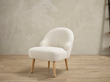 Load image into Gallery viewer, Ted Chair White LPD TEDCHAWHITE 5036464072531 Boucle Colour: White Dimensions: 680mm x 570mm x 630mm Sleek and comfy the Ted chair has it all! Simple yet stylish, the soft material of this chair will make it the perfect addition any room. Great for relaxing, the calming colours will reflect the mood you will feel once you sink into the soft cushioned seat. The Ted chair will easily make an eye-catching statement in your home.