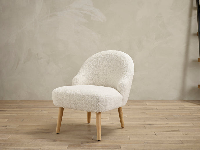 Ted Chair White LPD TEDCHAWHITE 5036464072531 Boucle Colour: White Dimensions: 680mm x 570mm x 630mm Sleek and comfy the Ted chair has it all! Simple yet stylish, the soft material of this chair will make it the perfect addition any room. Great for relaxing, the calming colours will reflect the mood you will feel once you sink into the soft cushioned seat. The Ted chair will easily make an eye-catching statement in your home.