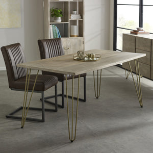 Light Gold Dining Table Indian Hub BRC08 7625987873725 Dimensions: 76cm x 160cm x 85cm (Height x Width x Depth) Drawer/Cupboard: Table top thickness: 3 cm Solid Mango Wood Gold metal inlays Eco-Friendly wood used Partial Assembly required Colour variations due to natural wood colour Made in INDIA This modern contemporary style furniture combining metal inlay on solid wood creating an abstract style is taking the furniture making to a whole new level The angled legs made of metal adds to the retro vintage lo